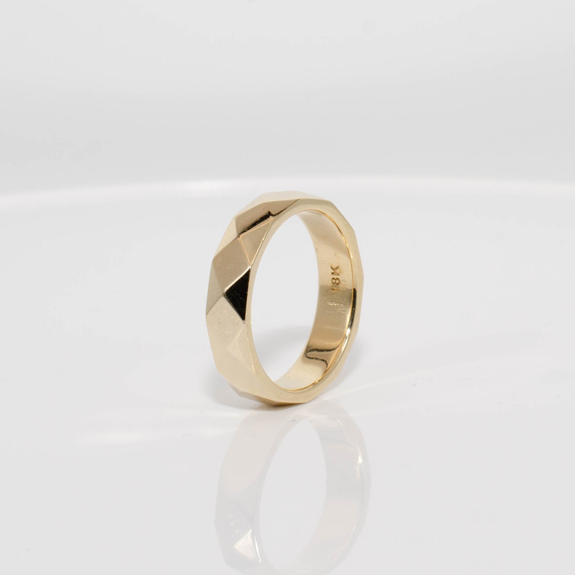 Gold ring on a white background