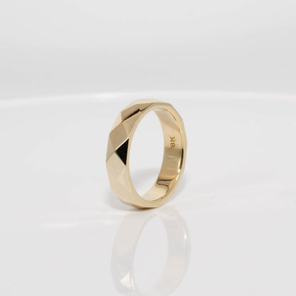 Gold ring on a white background